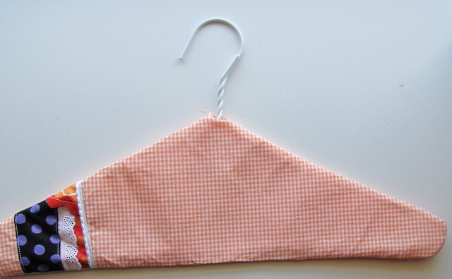 clothes hanger , fabric covered coat hanger