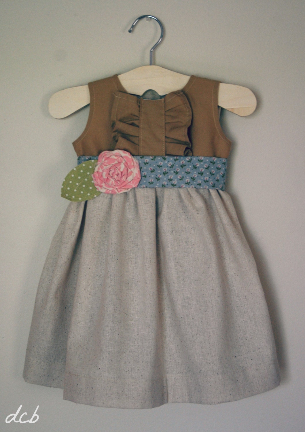 Neutral cotton dress with rose sash