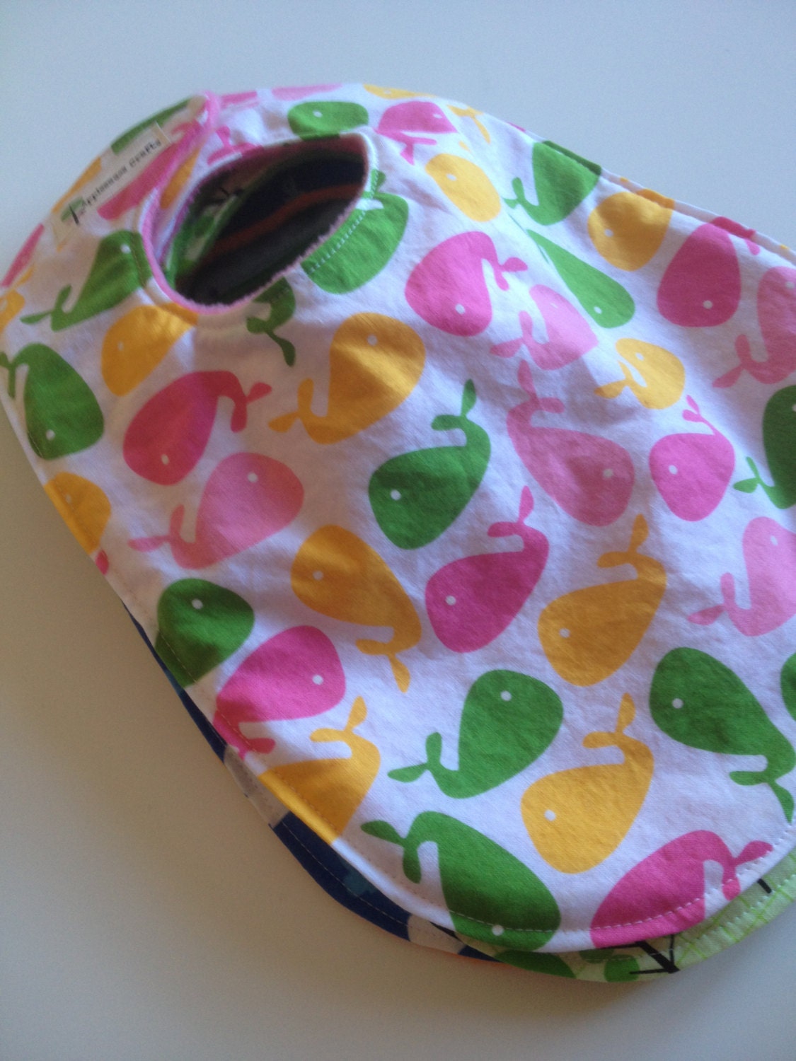 Large Bib in Whales Pink Green Yellow with Pink Fleece Backing