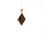 gold geometric diamond shaped necklace // cross stitched x // colorful