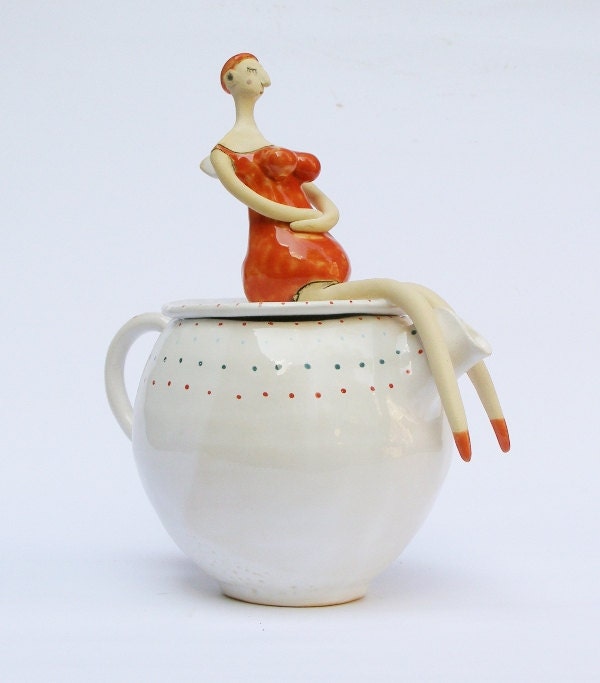 Beautiful old swimmer on teapot with polka dot