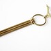 The Brass Fringe brooch