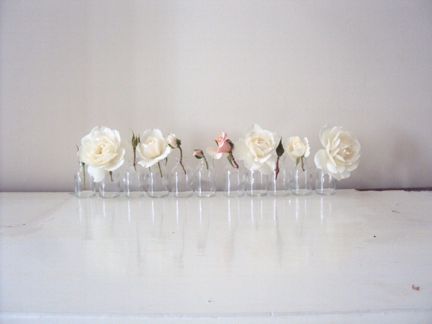 Eleven upcycled mini mini milk bottles.Great for weddings resturants.