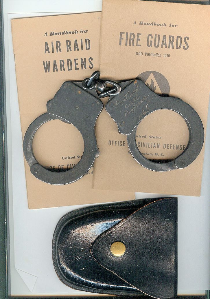 WWII Civil Defense issue Handcuffs and Holster, with two Civil Defense Handbooks