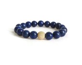 lapis lazuli bracelet in blue with natural gold flecks.  gold stardust focal bead. stretch bracelet for summer.
