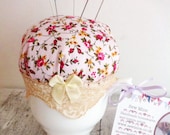 Teacup pincushion with heart dressmakers pins