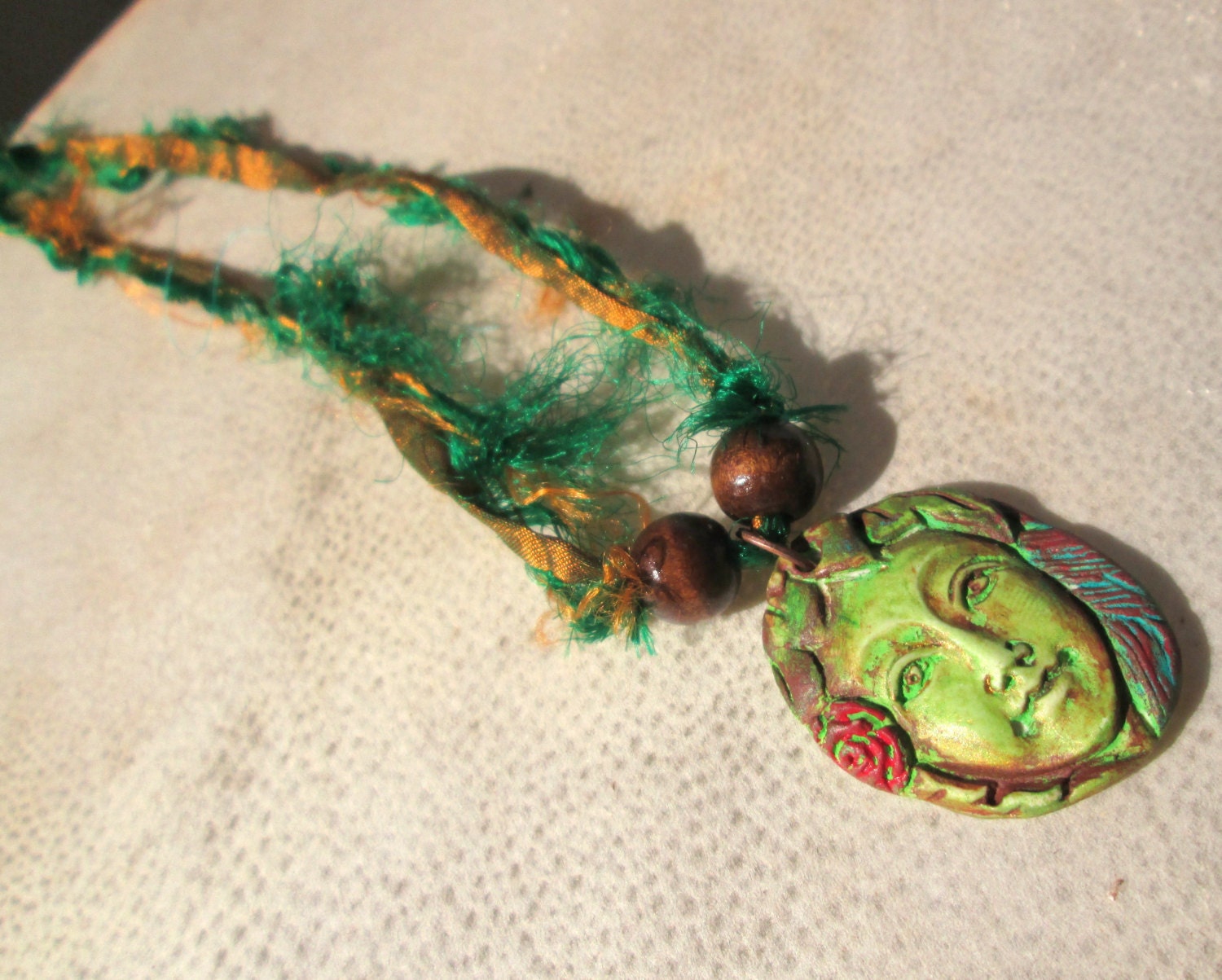 Gaea. Bohemian Polymer Clay Pendant on Green Recycled Sari Silk Ribbon Necklace. Hand-Painted Forest Green, Red, Turquoise, Moss Green.