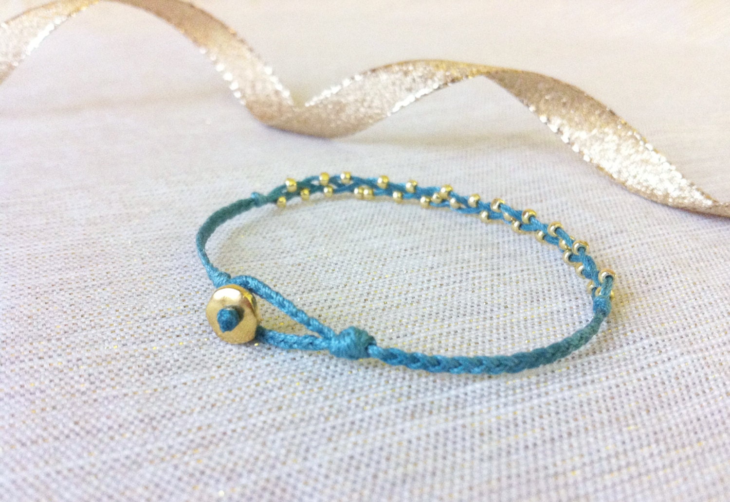 olivia. tiny gold nuggets everyday braided bracelet with beaded closure