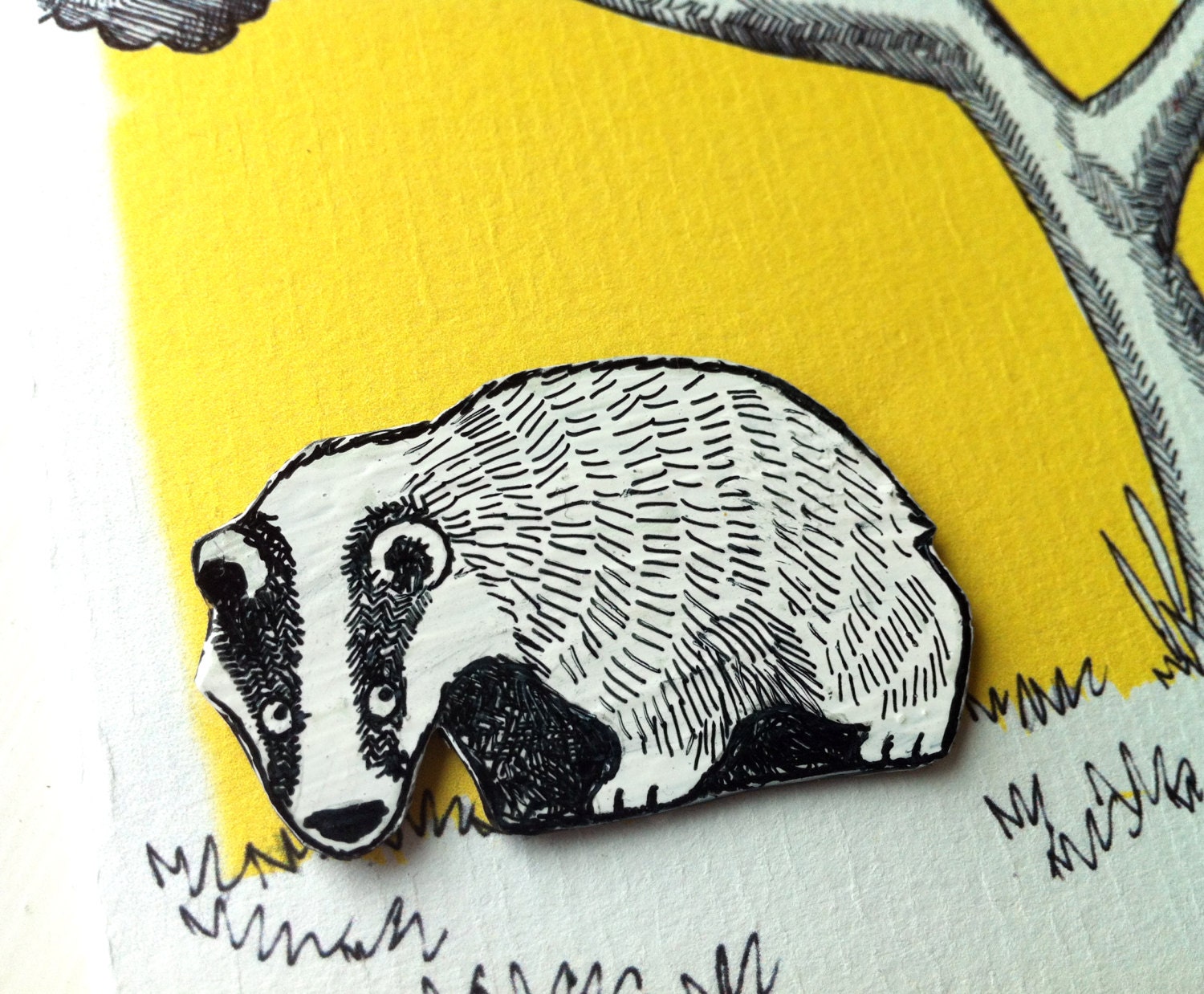 Badger Badge plastic black and white brooch