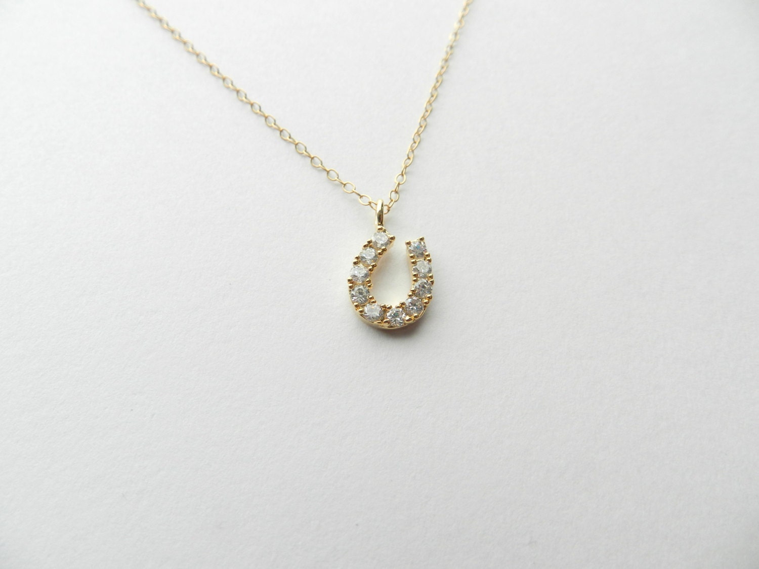 Itty Bitty CZ horseshoe with 14k gold filled chain.
