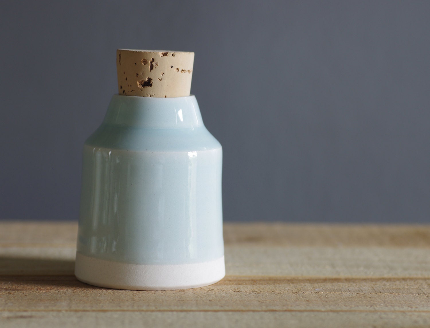 light blue bottle / vase. white porcelain clay with light blue glaze. modern minimal pottery ceramic