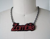 Zombie in Barbie Font Text Necklace, Red Glitter and Black.