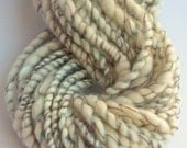 Vortex -  Hand spun art yarn. Coiled merino and painted silk with pure wool threads.
