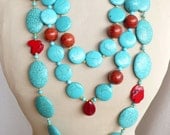 Very large statement bib necklace with blue howlite turquoise stones, red howlite, red coral  in different shapes and one red ruby
