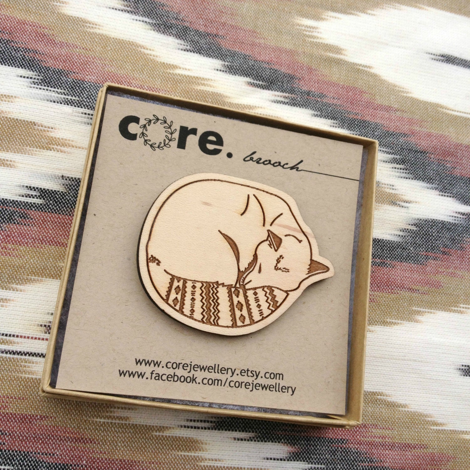 Sleeping fox wood brooch with native tribal inspired geometric chevron markings