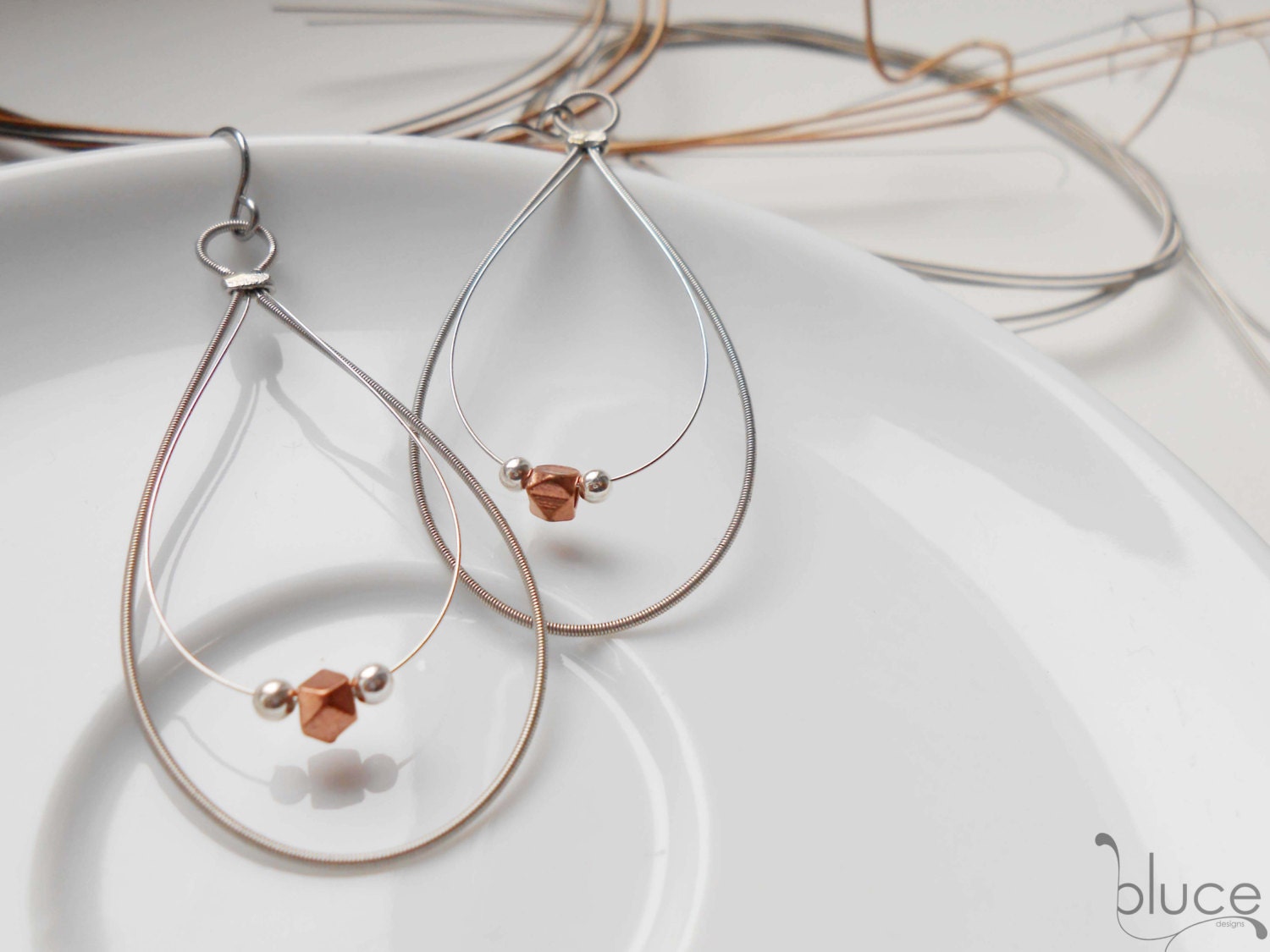 Silver and copper, teardrop, guitar string earrings. Upcycled Recycled Repurposed materials. Minimalist style, guitar string jewelry