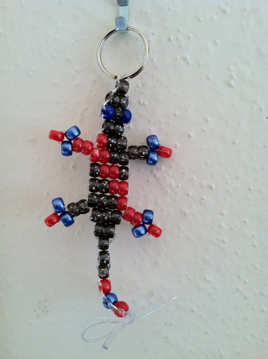 KINDA LIKE SPIDERMAN - Small "Lucky Lizard" with Red, Sparkle Black, and Pearl Blue Beads - Double Diagonal Design - Handmade to Save Lives
