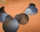 Ombre blue and black geometric circle bib necklace