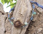 Ocean Waters multi strand bracelet with Vintaj starfish and sand dollar, pearls, Czech glass, seed beads, and Vintaj swirl clasp