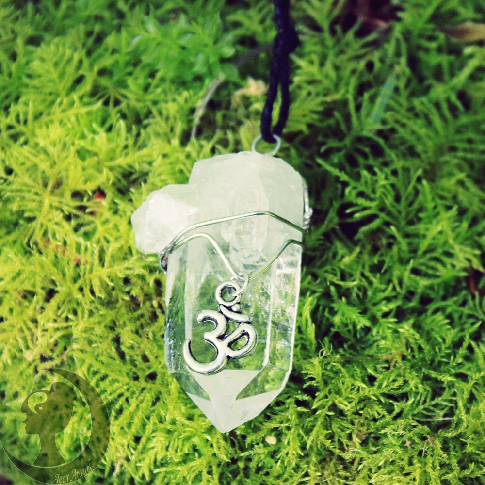 quartz crystal necklace with ohm symbol charm