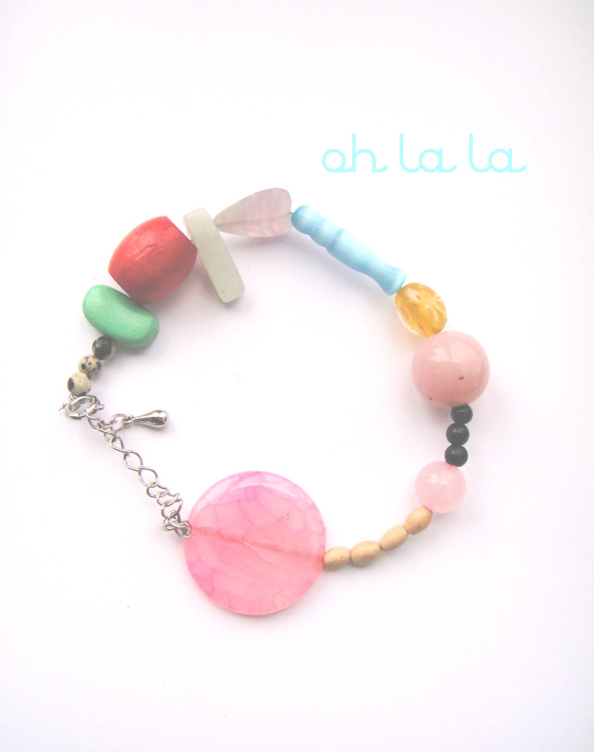 handmade bracelet with red, pink, mint, blue, black and yellow beads.