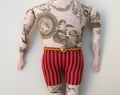 Big Man doll with Cherub tattoos