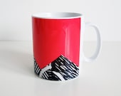 Bright red mug with lino print design