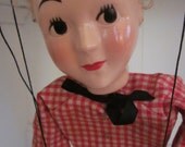 Vintage 1950's Marionette Hazelle Wooden Airplane Control Blonde Hair, Black Bow, Red Checkered Shirt with Gold Stars, and Blue Denim Pants