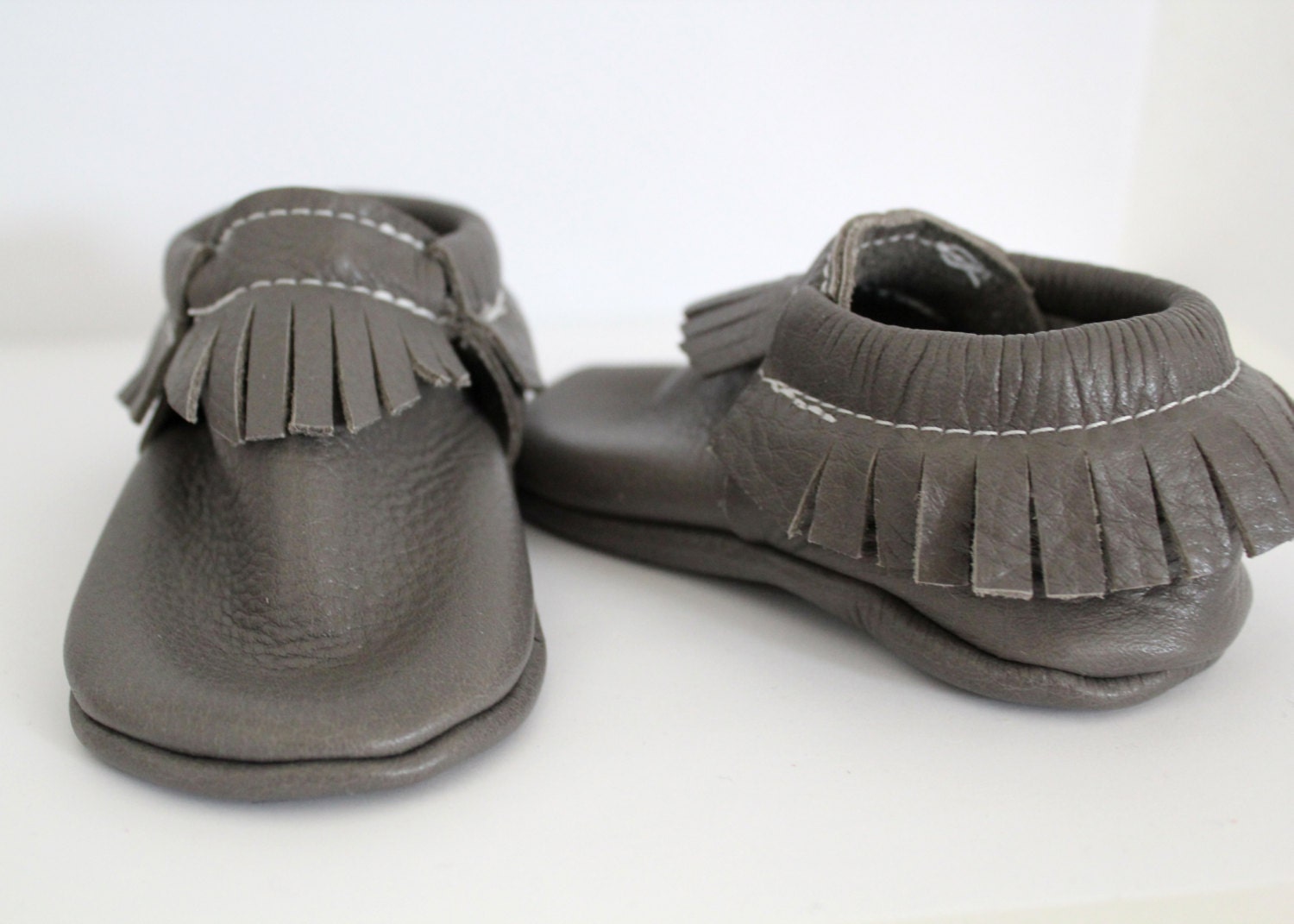 Gray leather baby moccs