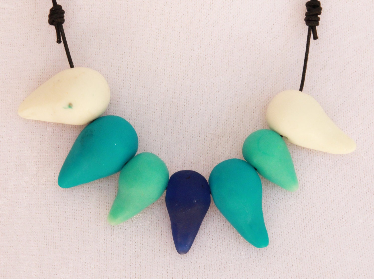 Shades of blue comma beads adjustable resin necklace