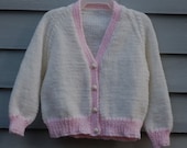 Baby girl, size 6/9 months, pink and white cardigan sweater.