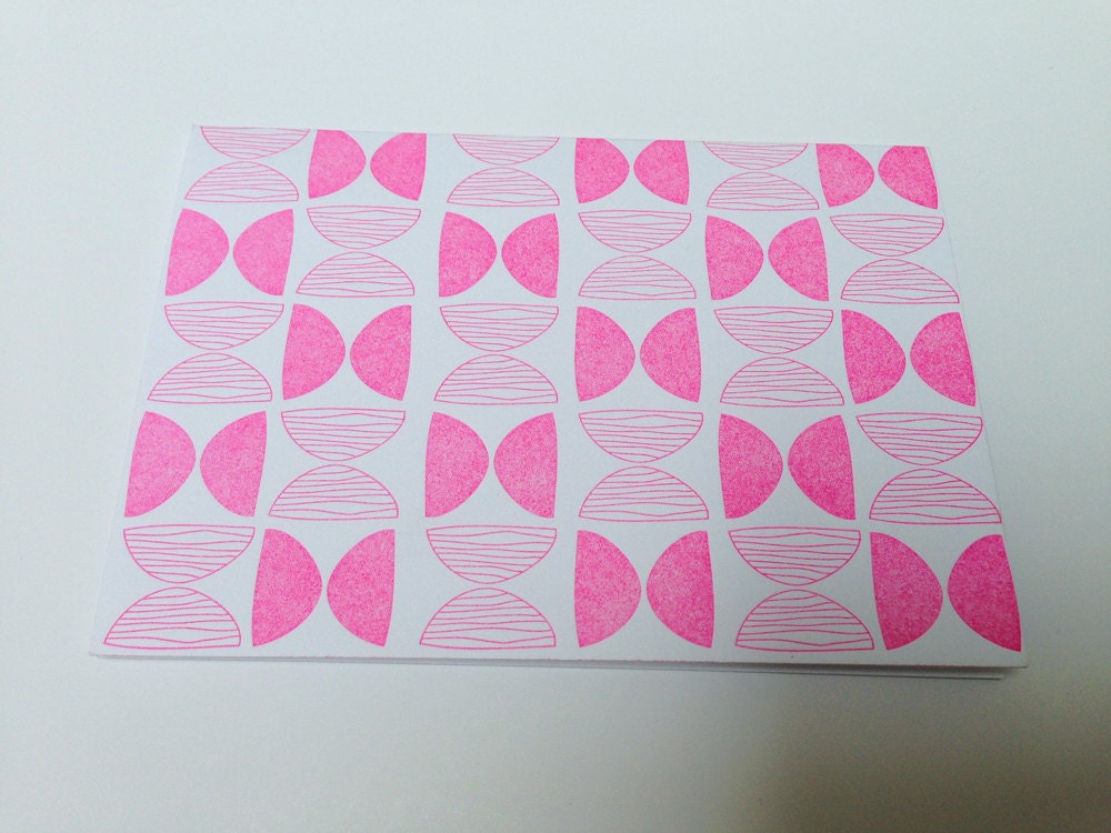 Neon pink folded pattern card, letterpress printed