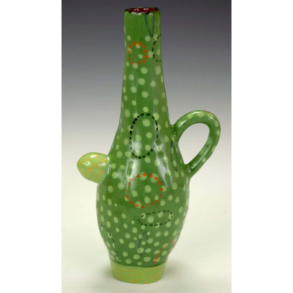 Eccentric Bottle With Loop And Lump Handles.