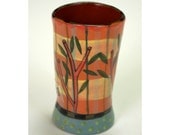 Plaid Cup With Stripes and Foliage.