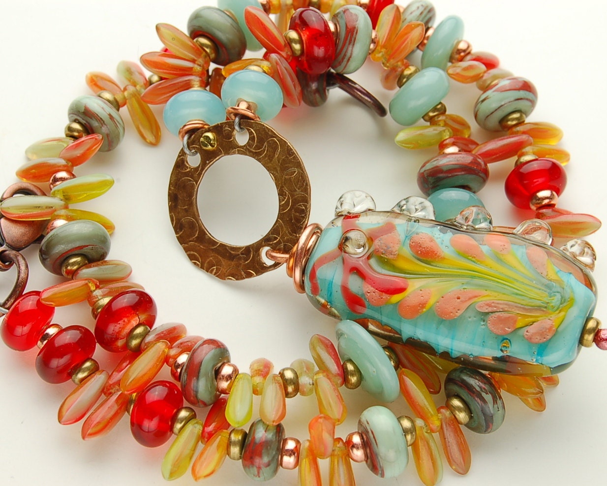 SOLD  Spring Flower Necklace in Glacier Blue and Clear Red Lampwork Glass