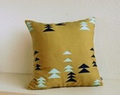 One green pillow with Alpine Print