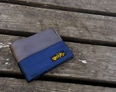 Seat belt wallet made from reclaimed seat belt straps and used bike inner tube