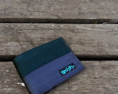 Seat belt wallet made from reclaimed seat belt straps and used bike inner tube