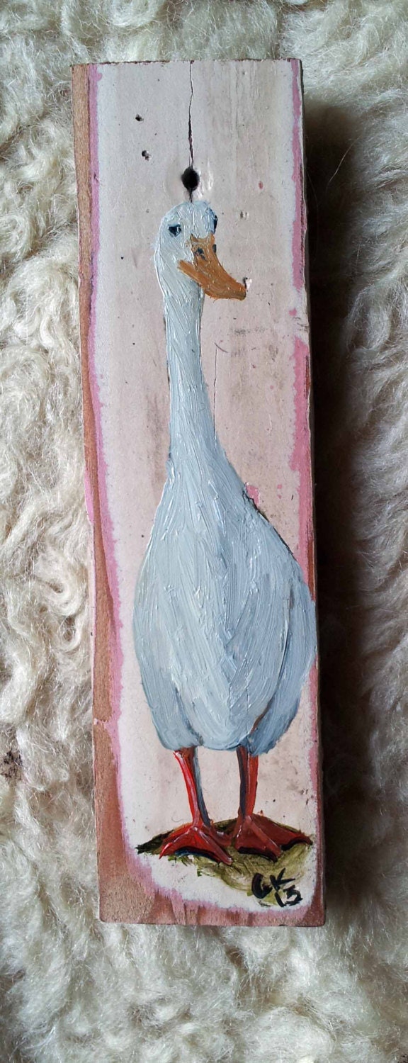 Little duck on wood