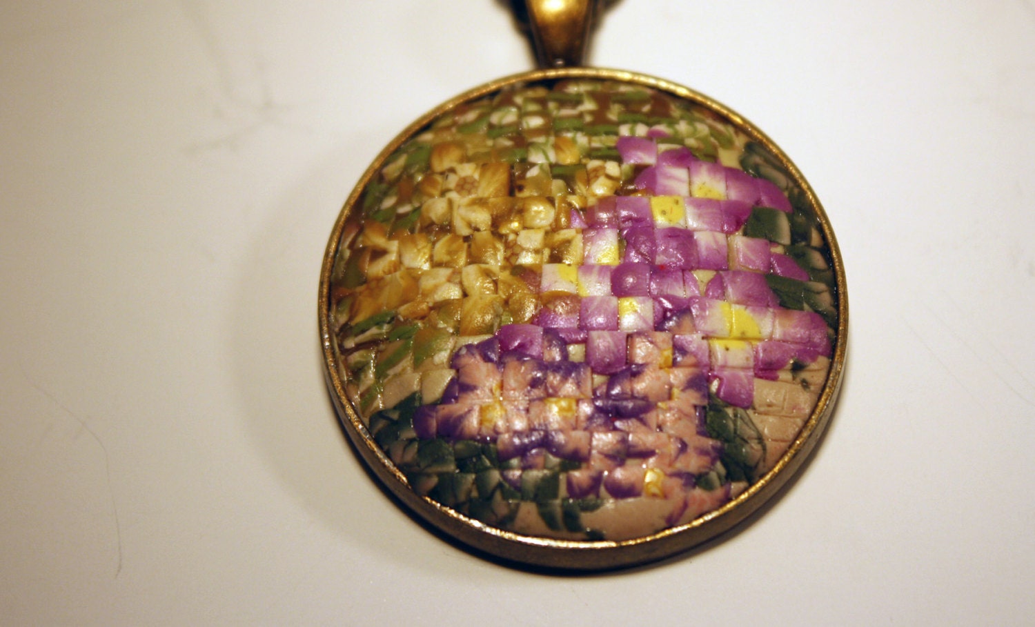 Pendant is created in Faux Needlepoint in polymer clay from floral arranfement handmade by me.