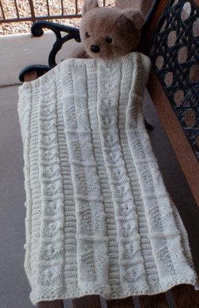 Hand knitted, beige/cream baby blanket in intricate pattern, for a boy or girl