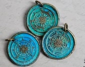 compass wax seal pendant with an aqua verdigris patina