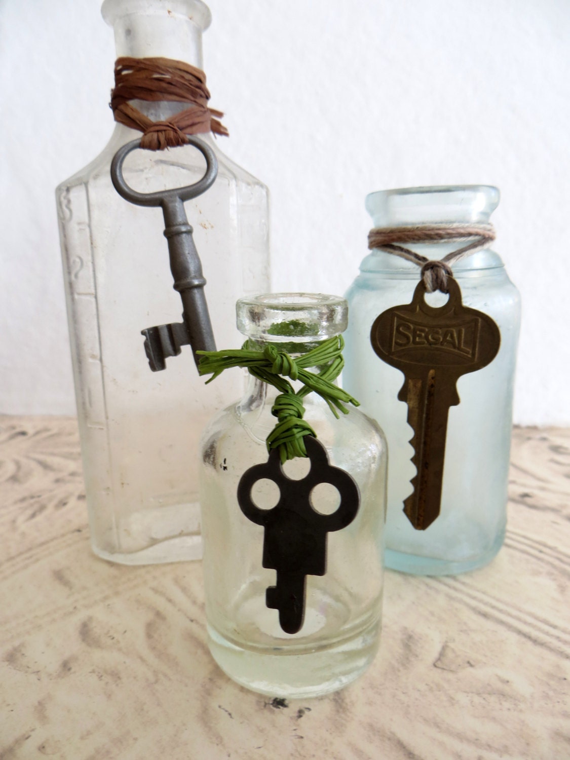 Three Old Vintage Medicine Bottles With Skeleton Keys