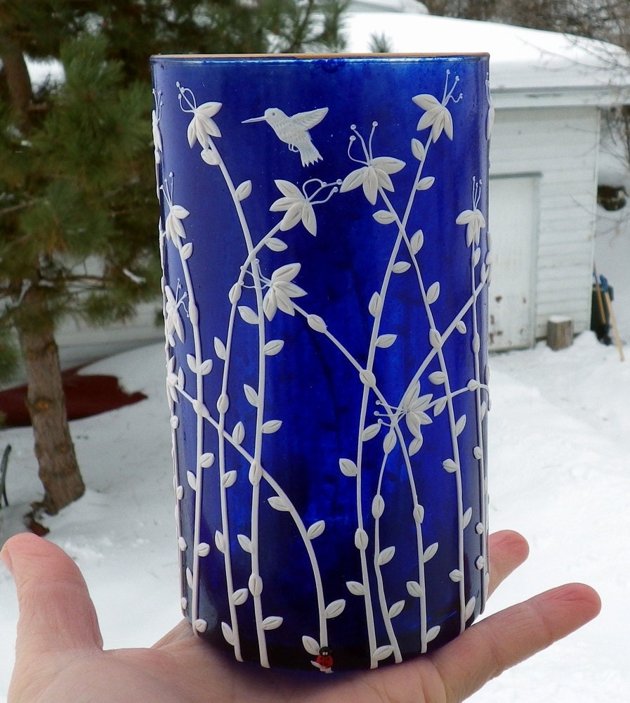 Hummingbirds frolic in the flowers Sculpted onto a recycled Glass Cobalt blue Candle Holder and Vase