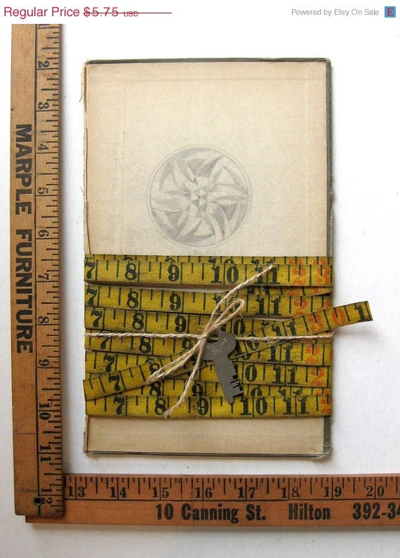 Pickers Sale. Vintage Aged Yellow Linen Measuring Tape (9 feet) on Vintage Math Book Cover, with Key