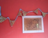 Recycled Sari Silk knitted bunting in bright green turquoise and red with Turquoise ribbon