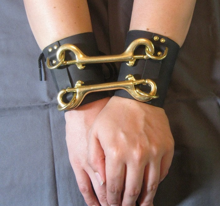black leather and brass bondage handcuffs