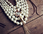 chunky pearly goodness: five strand vintage pearls with vintage floral image pendant vintage tassel multi-strand statement necklace