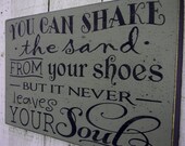 You can shake the sand from your shoes but it never leaves your soul - typography word art beach wood sign