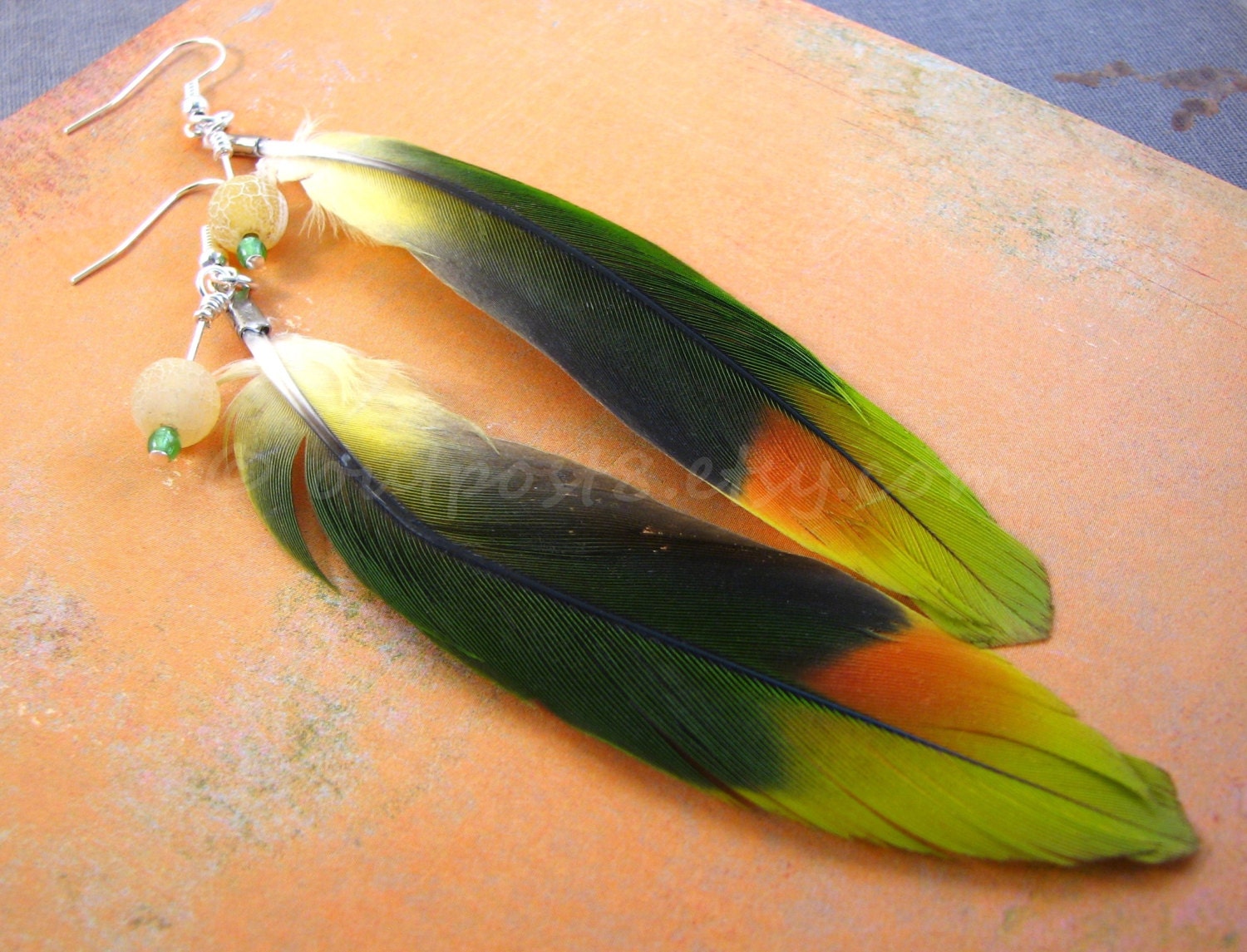 Love bird feather earrings. Tribal, found object, boho, dangle, green, orange. Free US shipping.